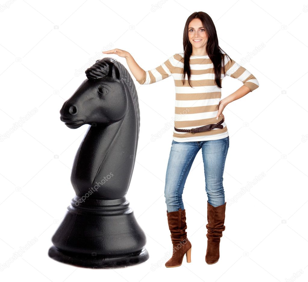 Beautiful brunette girl and a big chess knight