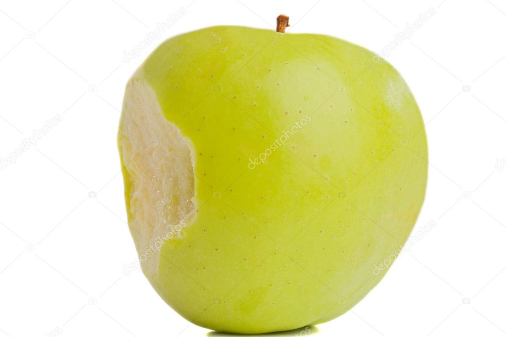 Green delicious apple with bite