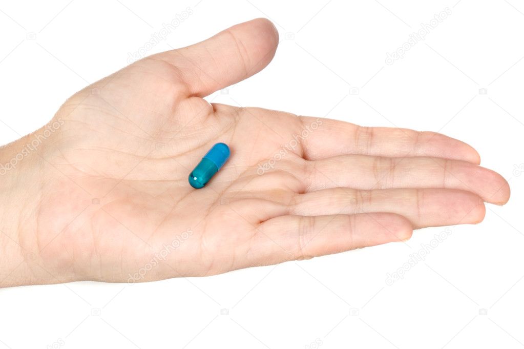 Hand with a pill