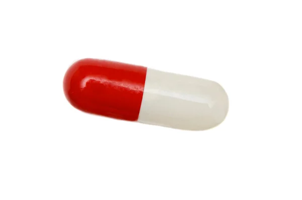Красно-белая таблетка — стоковое фото