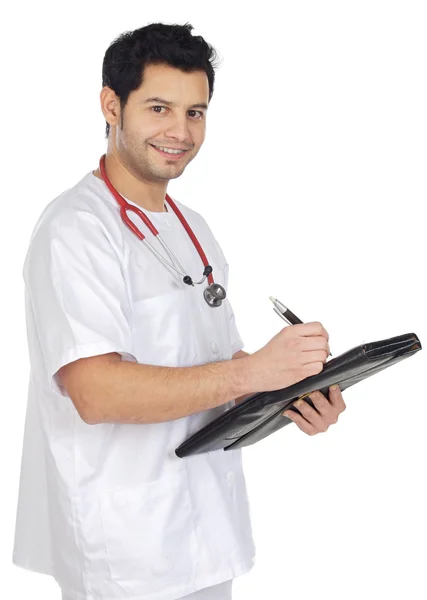 Jeune médecin prenant des notes dans un carnet — Photo