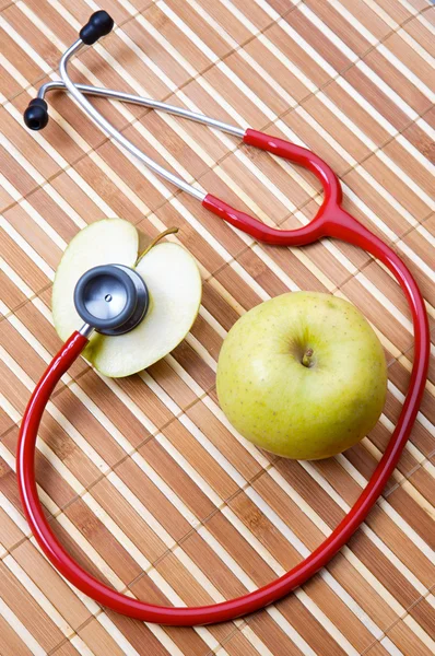 Stethoscope and apple — Stock Photo, Image