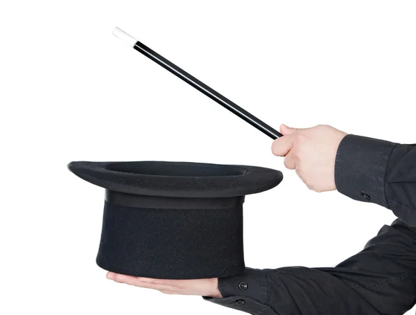 Mãos do mágico com varinha mágica e chapéu superior — Fotografia de Stock
