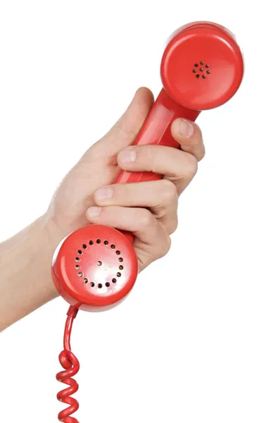 Dłoń trzymająca czerwony telefon — Zdjęcie stockowe