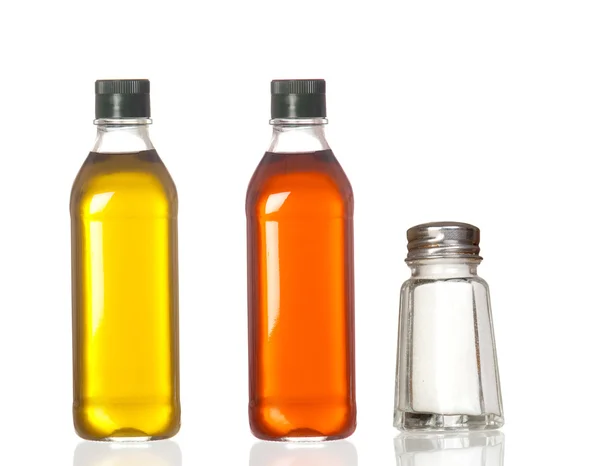 Bottles of oil, vinegar and salt boat — Stock Photo, Image