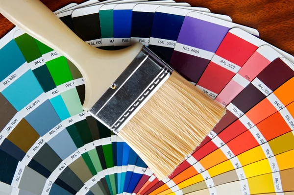Paintbrush with card of colors — Stock Photo, Image