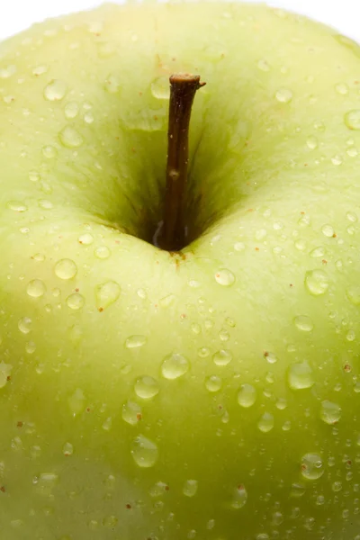 Macro of green delicious apple with reflection — Stock Photo, Image