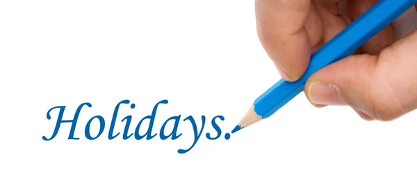 Mano con pluma azul escribiendo la palabra "Vacaciones " — Foto de Stock