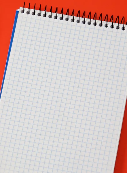 Photo of one notebook in blank with blue squares — Stock Photo, Image