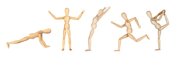 Jointed wooden mannequin doing different positions — Stock Photo, Image