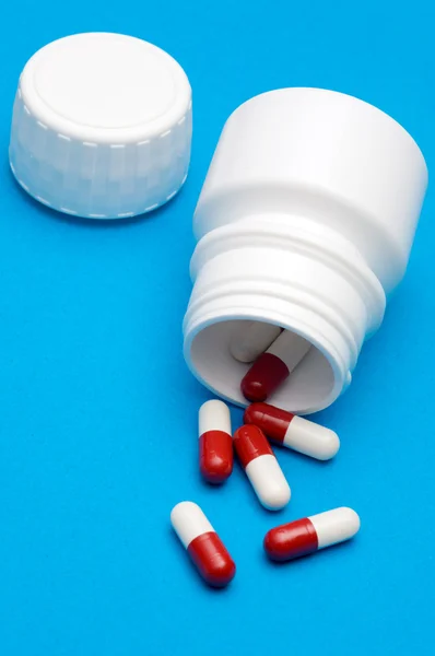 Pills over blue background — Stock Photo, Image