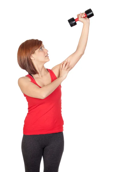 Beautiful redhead girl lifting weights — Stock Photo, Image