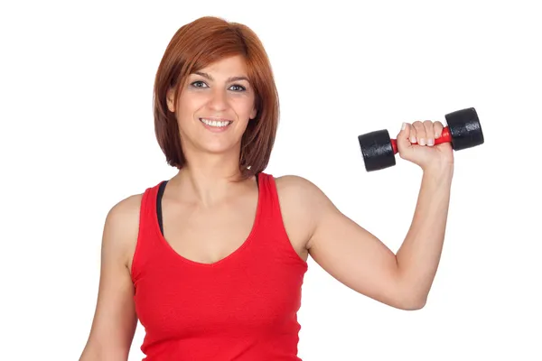 Beautiful redhead girl lifting weights Stock Picture
