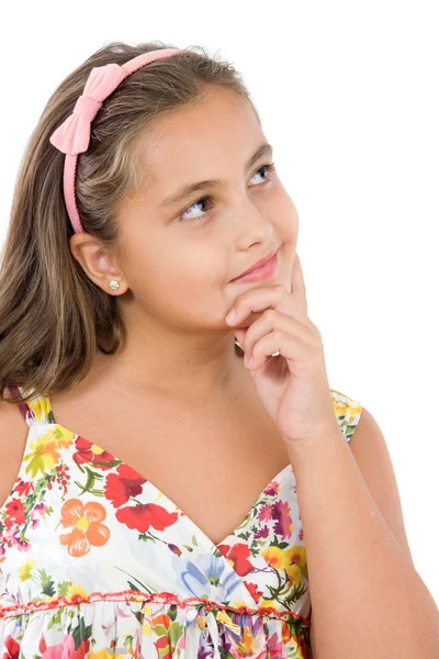Schattig meisje met bloemrijke jurk denken — Stockfoto