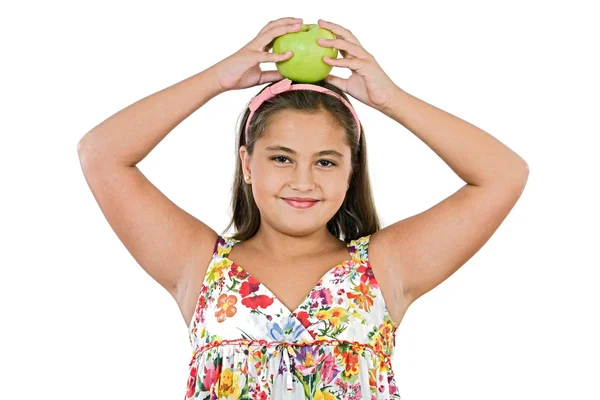 Adorable chica con vestido de flores con una manzana —  Fotos de Stock