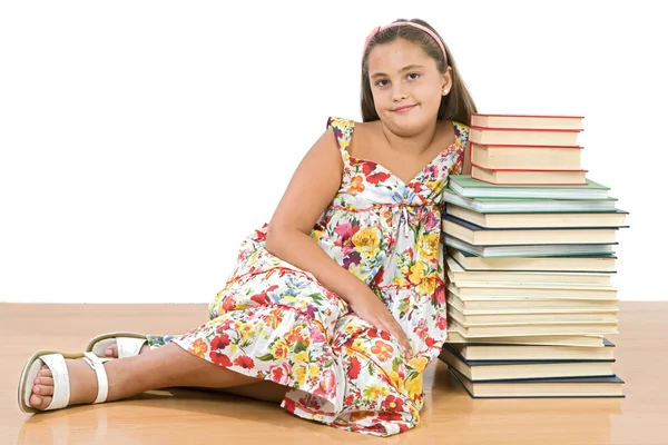 Entzückendes Mädchen mit vielen Büchern — Stockfoto