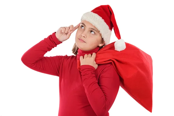 Menina bonita com chapéu de Papai Noel pensando — Fotografia de Stock