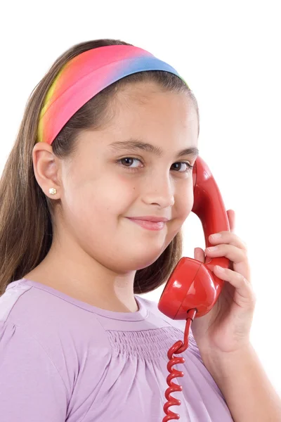 Красивая девушка с красным телефоном — стоковое фото