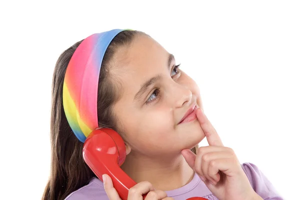 Mooi meisje met rode telefoon denken — Stockfoto