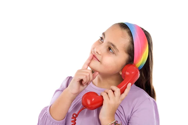 Mooi meisje met rode telefoon denken — Stockfoto