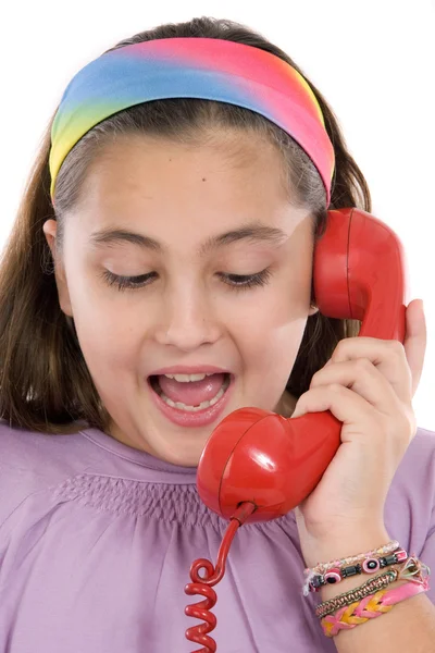 Menina bonita com telefone vermelho muito feliz por boas notícias — Fotografia de Stock