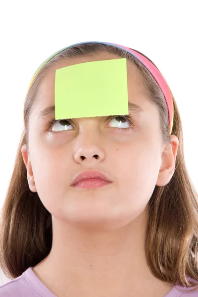 Entzückendes Mädchen mit einem Papier vor der Nase — Stockfoto