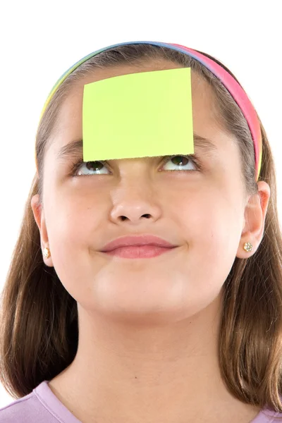 Adorable girl with post-it in her front — Stock Photo, Image