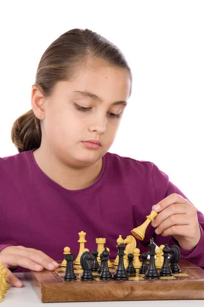 Attractive little girl playing chess — Stock Photo, Image