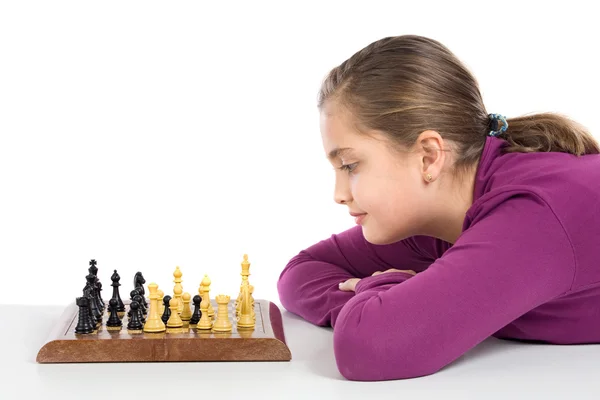 Attractive little girl playing chess — Stock Photo, Image