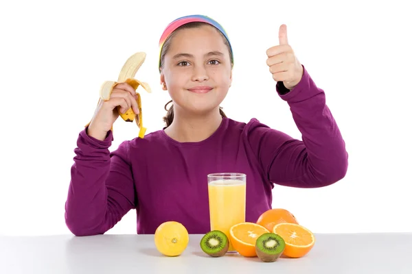 Cute girl with many fruits — Stock Photo, Image