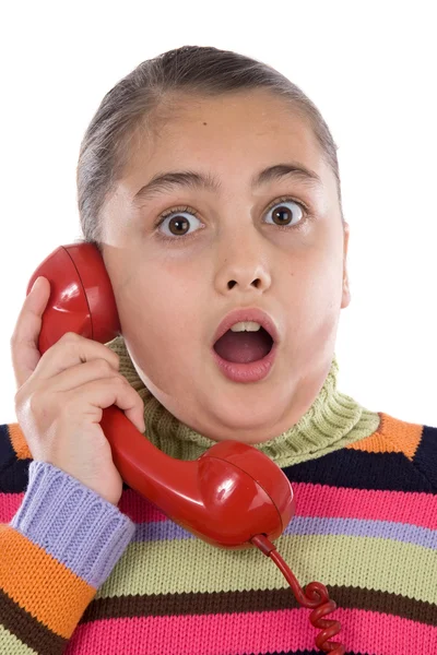 Mooi meisje met rode telefoon erg blij voor goede nieuws — Stockfoto