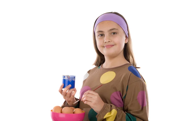 Adorable girl adorning Easter eggs — Stock Photo, Image