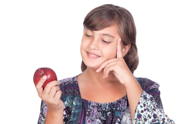 Adorable niña preadolescente con una manzana pensando — Foto de Stock