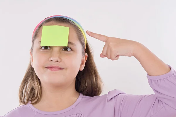 Adorable girl squint with a note — Stock Photo, Image
