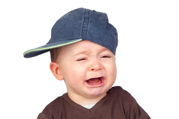 Vacker baby gråter en mössa — Stockfoto