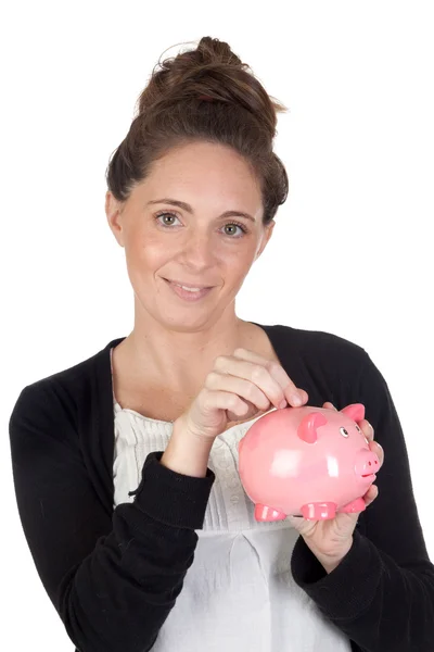 Attractive girl with money box insert coin — Stock Photo, Image