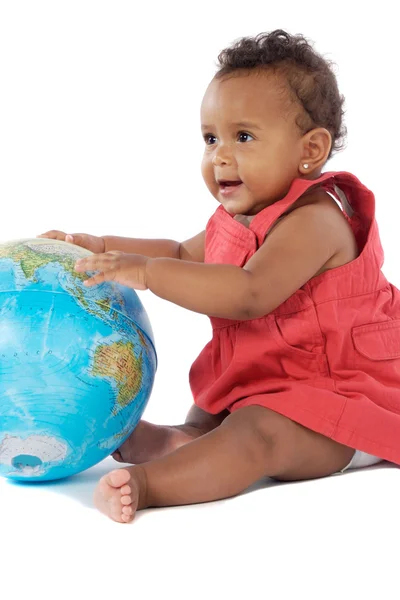 Meisje van de baby met een globe van de wereld — Stockfoto