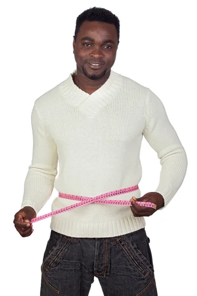 Attractive african man with a tape measure — Stock Photo, Image