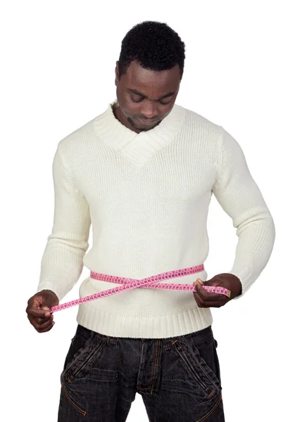 Atractivo hombre africano con una cinta métrica — Foto de Stock