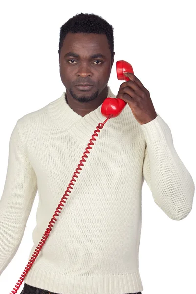 Ελκυστική Αφρικής άνδρας με ένα κόκκινο τηλέφωνο — Φωτογραφία Αρχείου