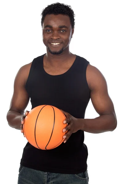 Приваблива молода людина з баскетбольним м'ячем — стокове фото