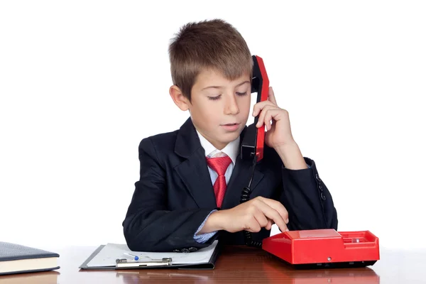 Маленький бизнесмен с красным телефоном — стоковое фото