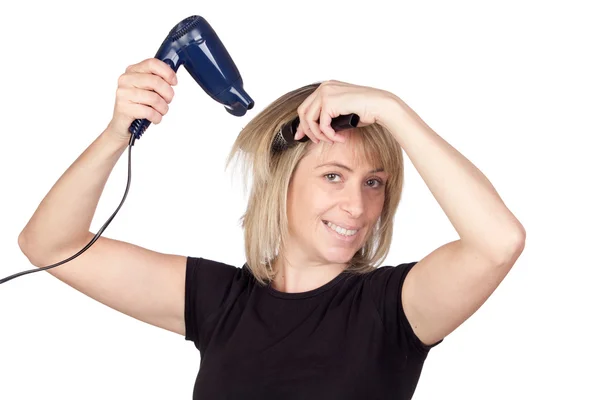 stock image Blonde woman with a dryer