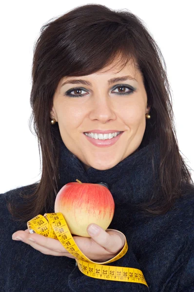 Menina atraente com maçã e fita métrica na mão — Fotografia de Stock