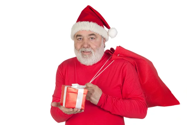 Смешной Санта Клаус с подарком и мешком — стоковое фото