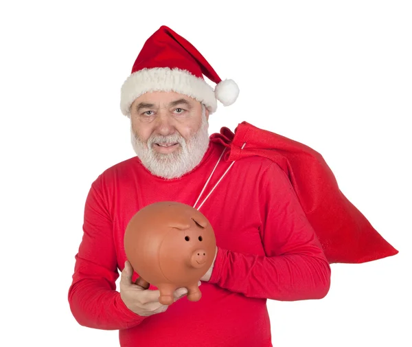 Santa Claus holding a piggybank — Stock Photo, Image