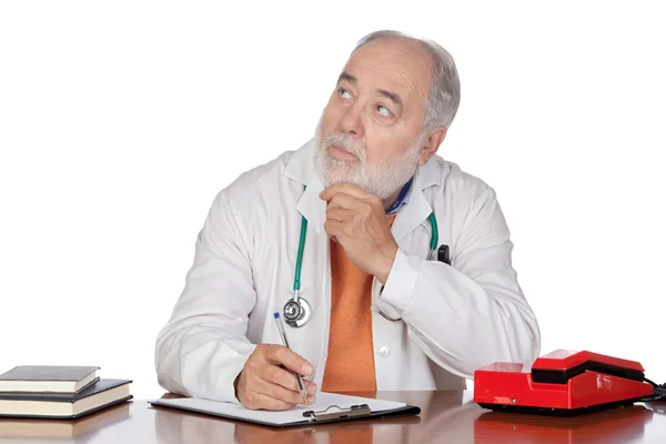 Pensive family doctor in the oficce — Stock Photo, Image