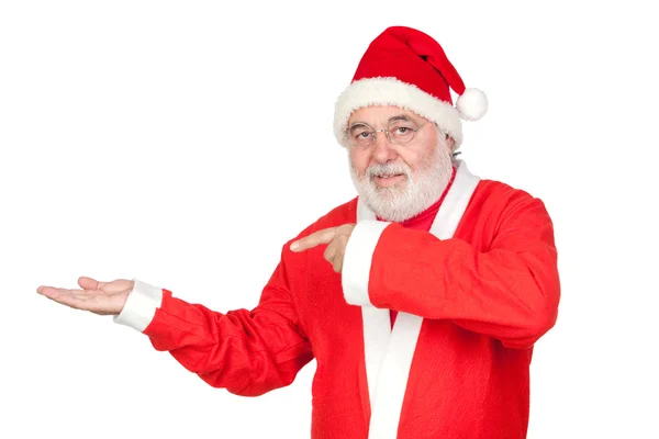 Santa Claus pointing to the outstretched palm of your hand — Stock Photo, Image