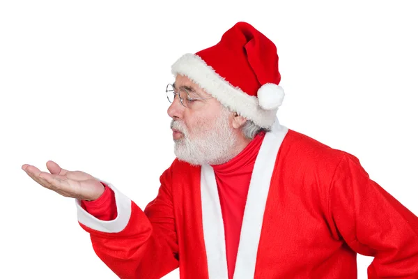 Santa Claus magically blowing in the palm of his hand — Stock Photo, Image