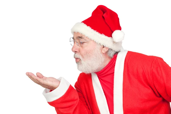 Santa Claus magically blowing in the palm of his hand — Stok fotoğraf